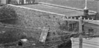 Side of the Stone building showing the construction style. Hidden partially from view today.